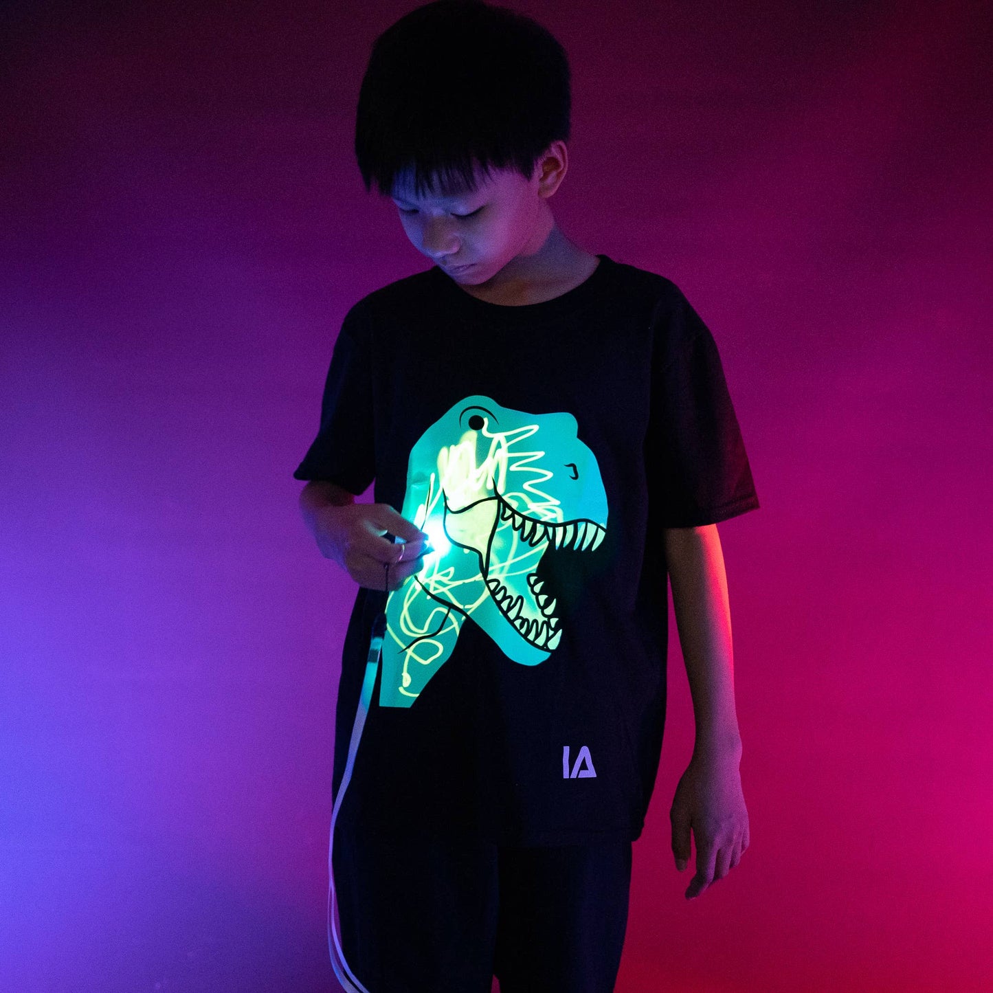 Illuminated Apparel - Interactive Glow T-Shirt - Dinosaur T-Rex: 7-8 Years Old